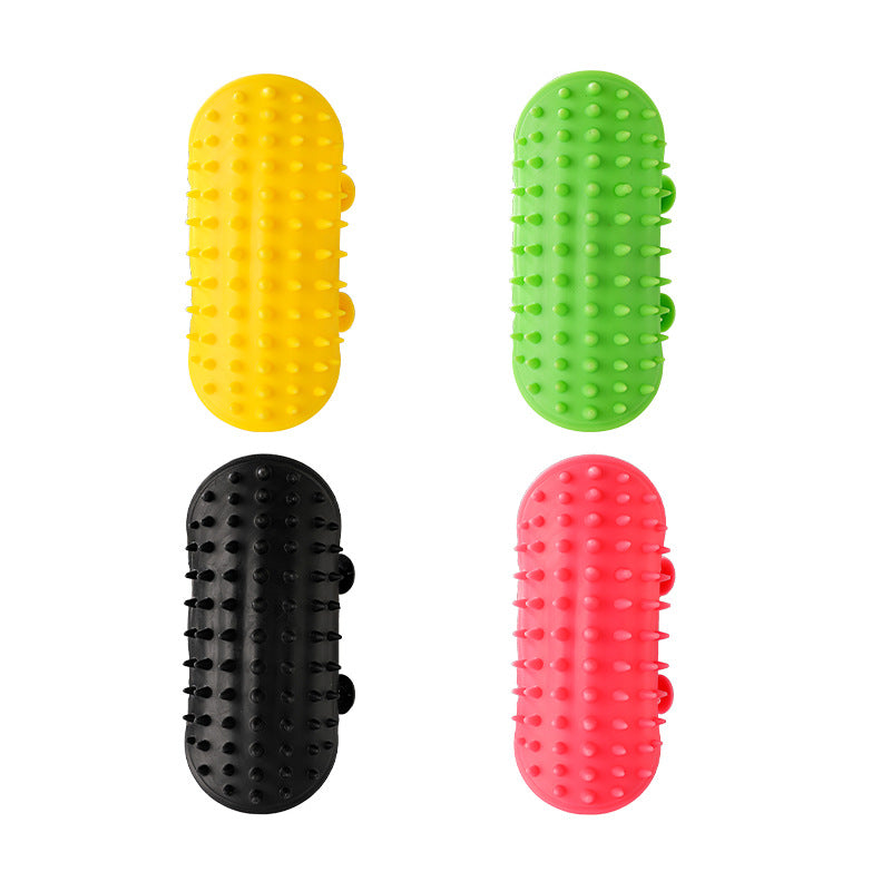 Silicone cat grooming brush wrapped around table leg for scratching and massage