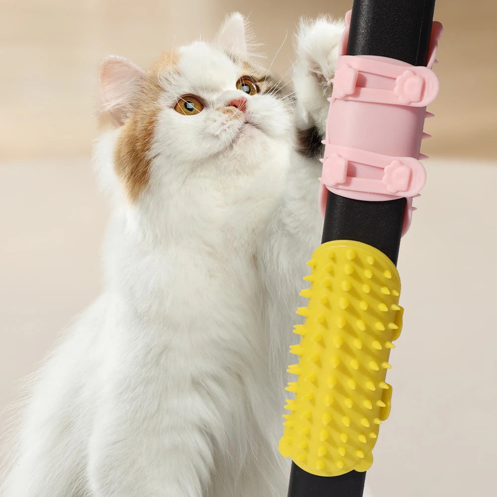 Silicone cat grooming brush wrapped around table leg for scratching and massage